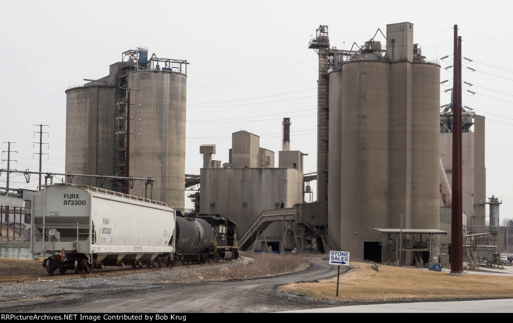 NS local train H75 heads east through the Nazareth Lehigh Heidelberg cement complex on its way to Stockertown